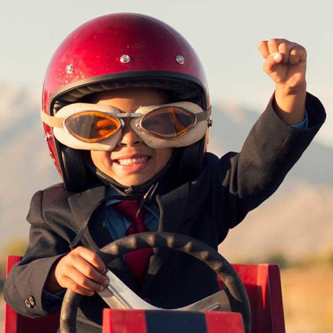 Child winning a go kart race.