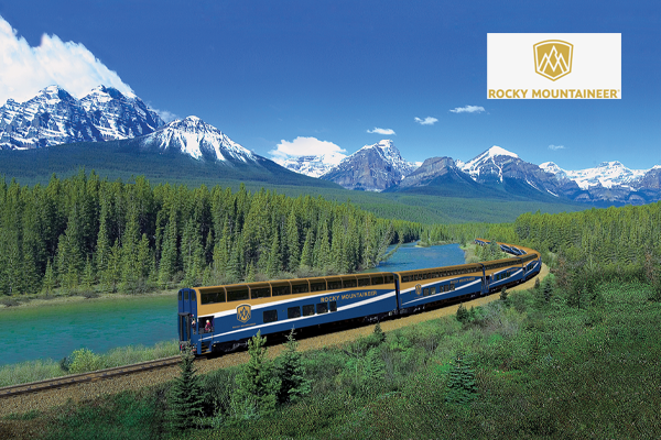 rocky mountaineer train with river, trees and mountain landscape