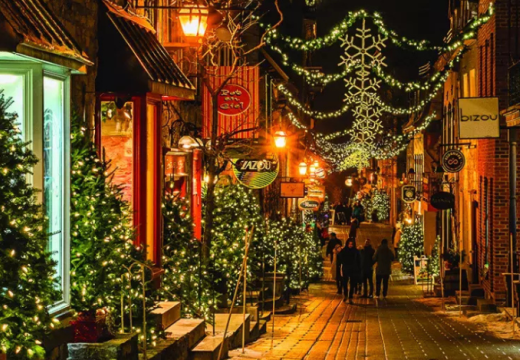 Quebec street in the evening at christmas time with christmas trees and lights