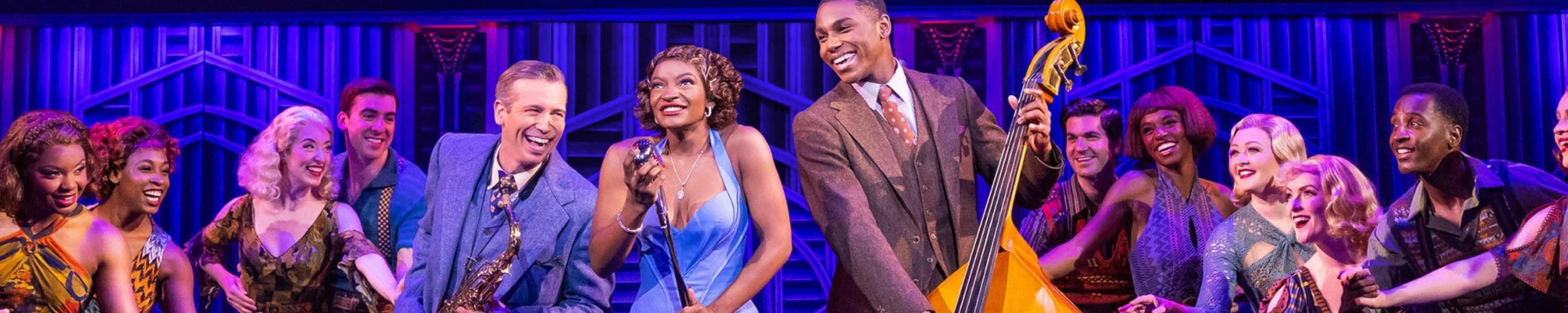 Actors on set for Some Like It Hot, with main characters in centre stage